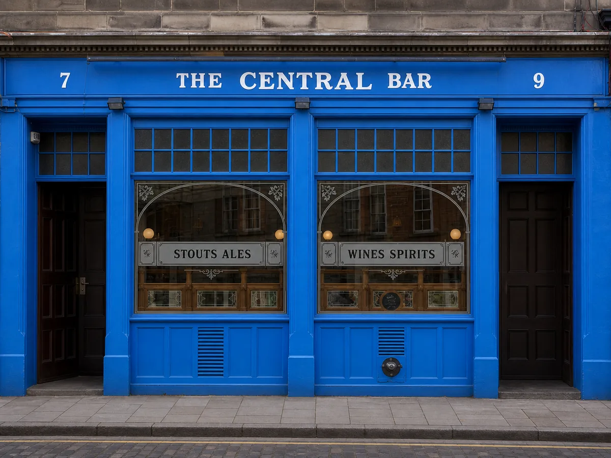 Bright blue Central Bar frontage with white name, street numbers and historic drinks panels.