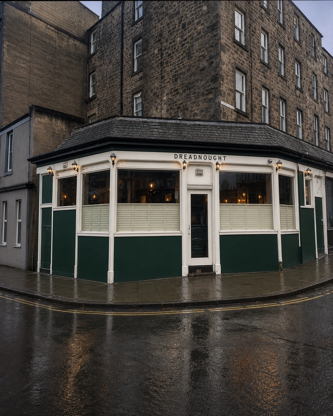 Dreadnought’s cream and green corner frontage with broad windows beneath a slate hood.