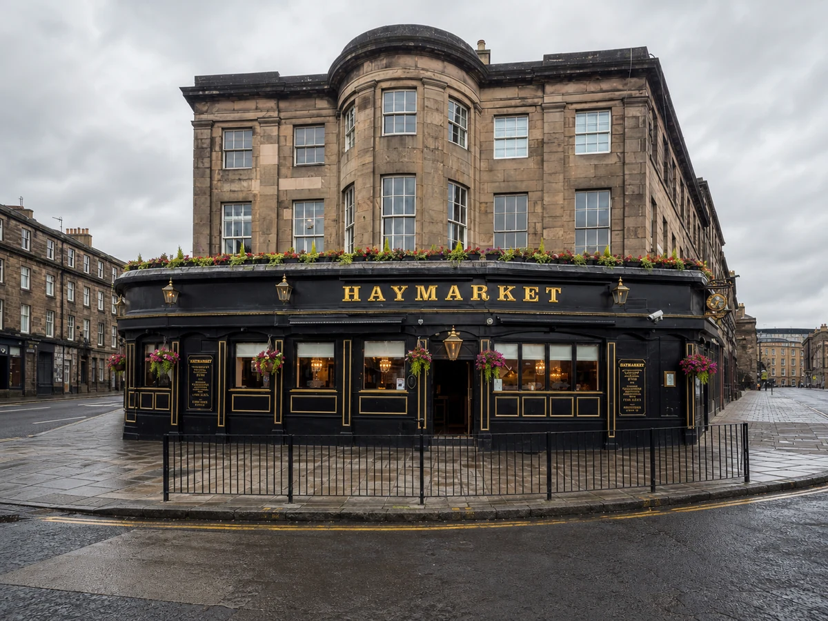 The Haymarket’s real-source-led curved West Maitland Street frontage, with named black-and-gold fascia and flower-boxed sandstone corner.