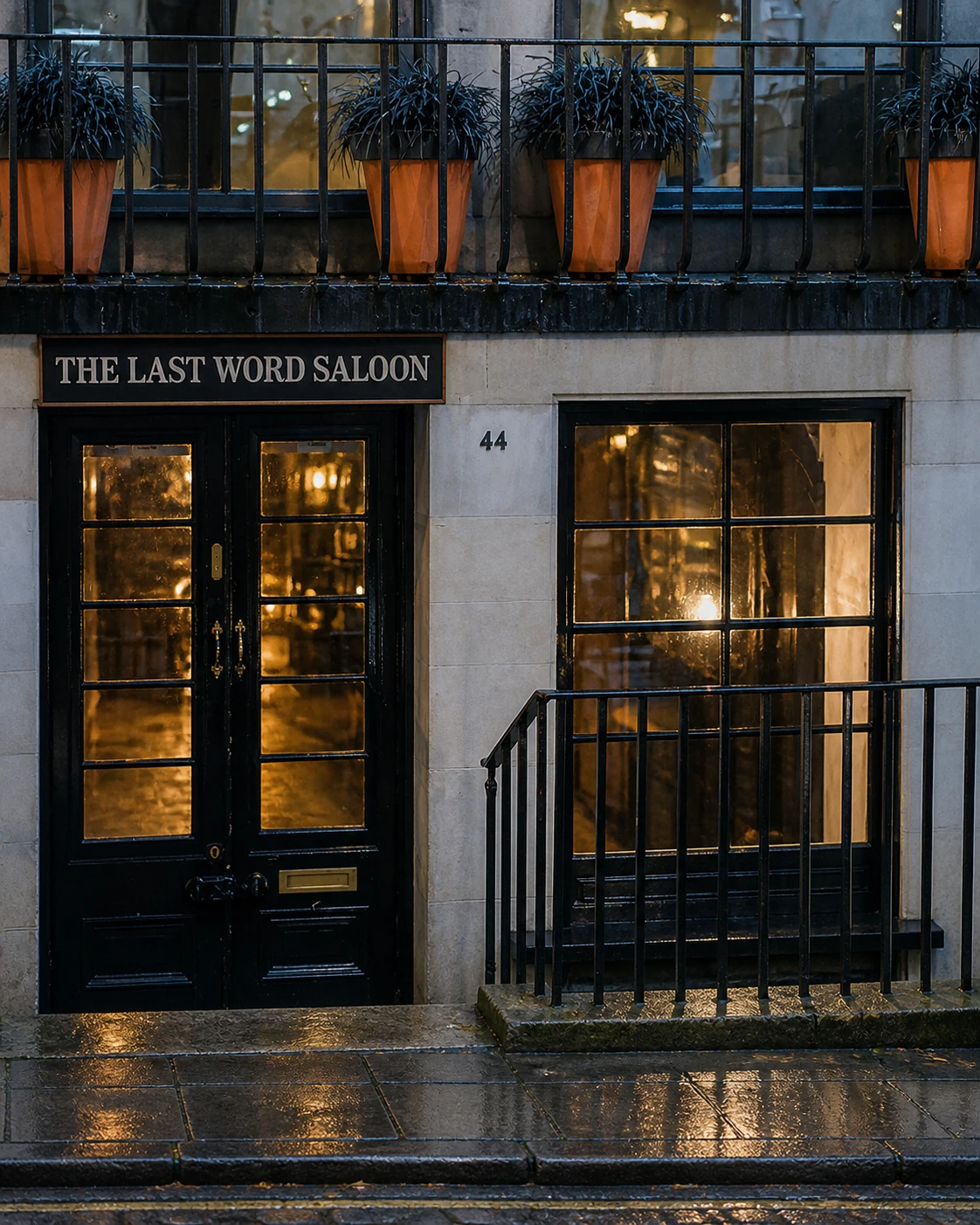 The Last Word Saloon’s black basement door and window at number 44, with its name above the entrance.