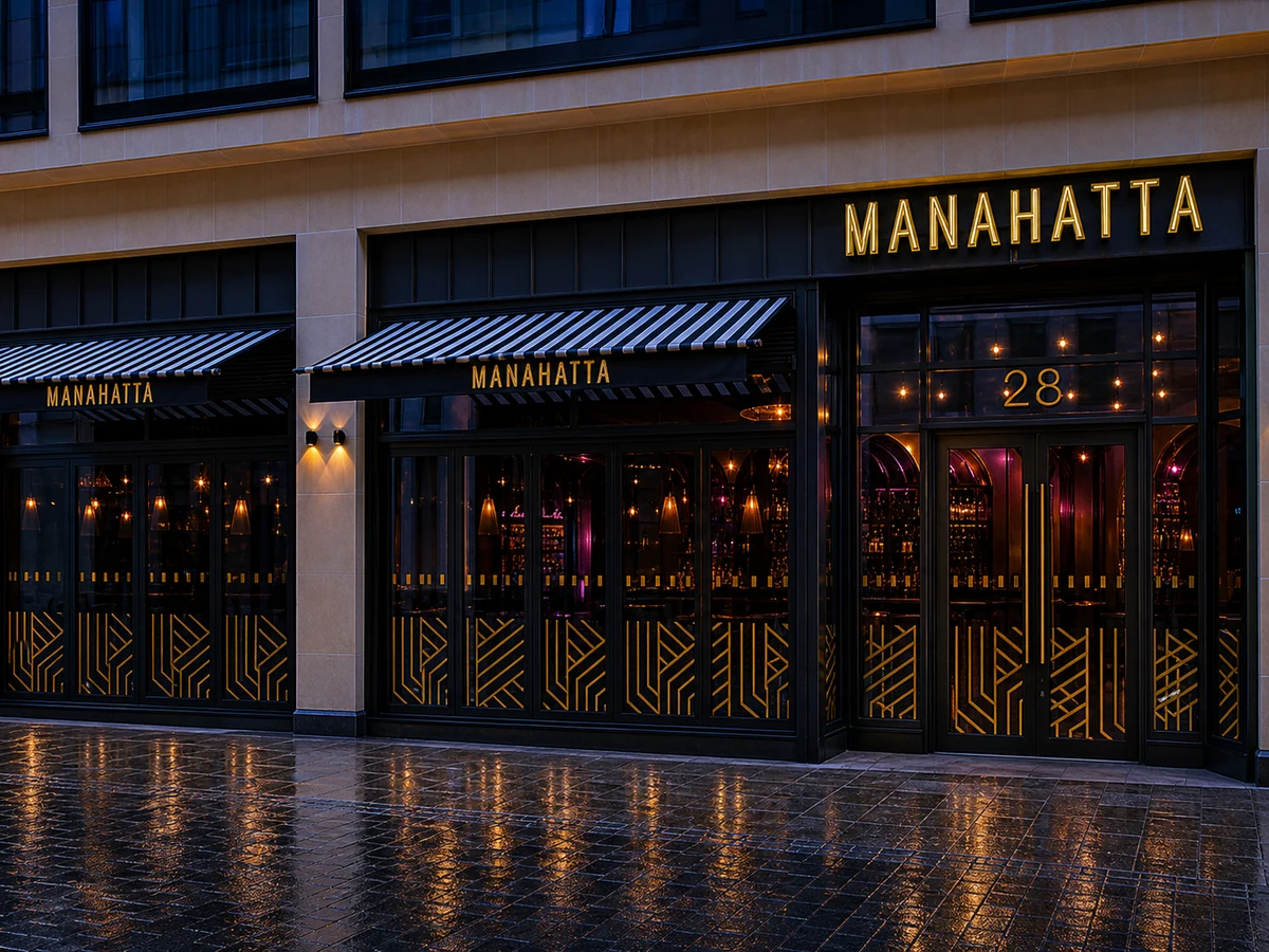 Manahatta’s source-led black-and-gold Art Deco Rose Street entrance, striped awnings, gold geometric glass and readable “MANAHATTA” and “28”.