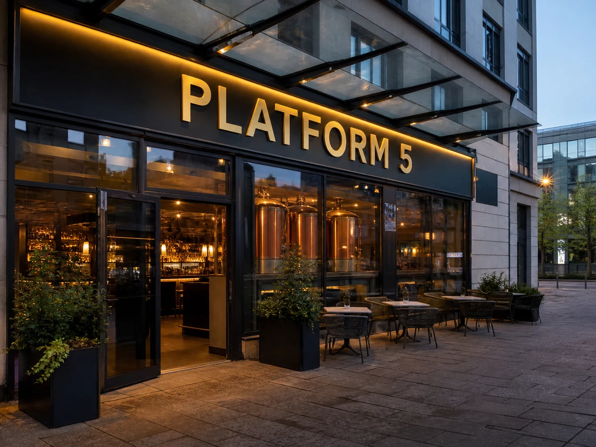 Platform 5’s named contemporary Haymarket frontage, with a glass canopy, terrace and copper tanks visible inside.