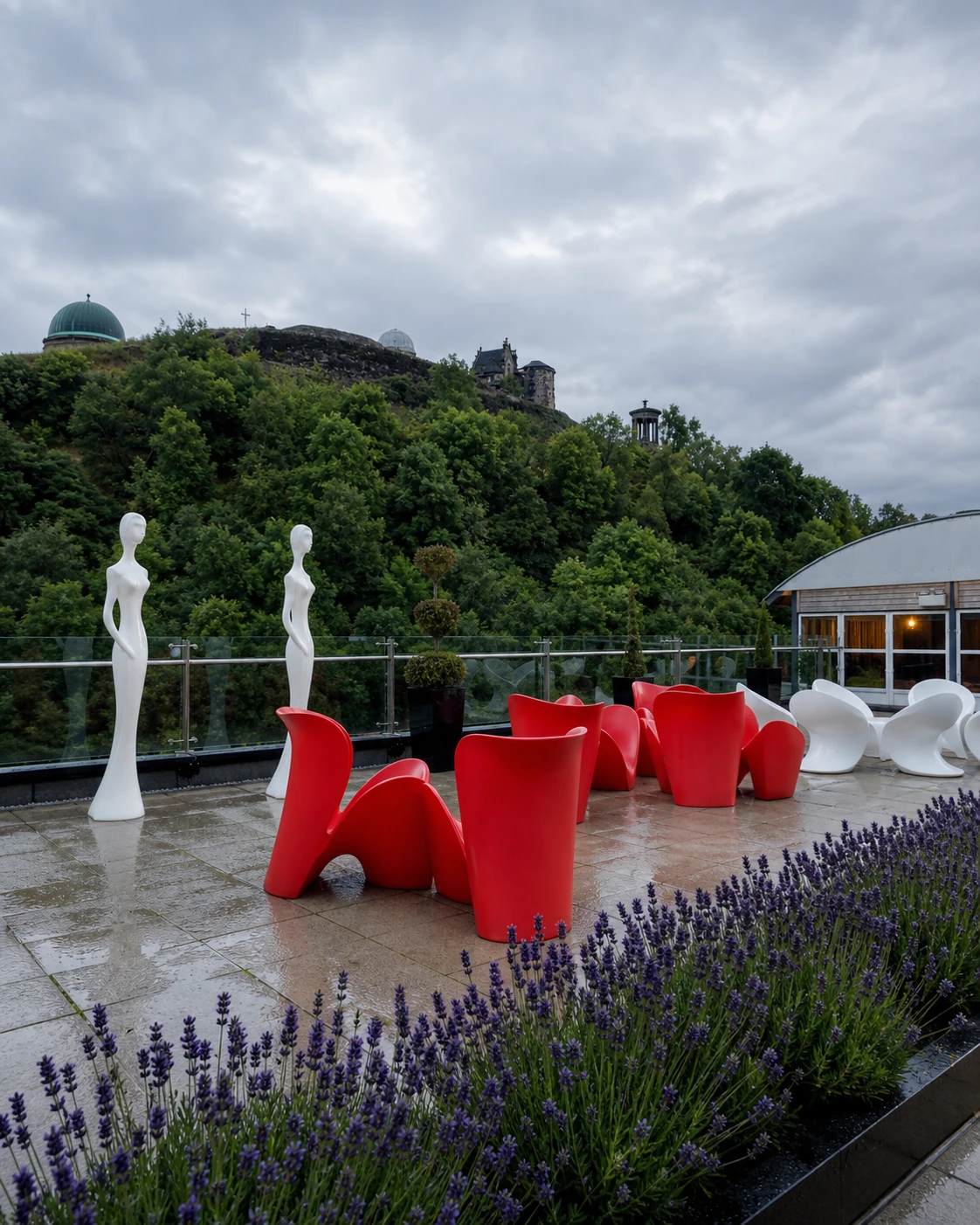 The Glasshouse Roof Garden’s red and white sculptural seating, lavender and glass terrace beneath Calton Hill.