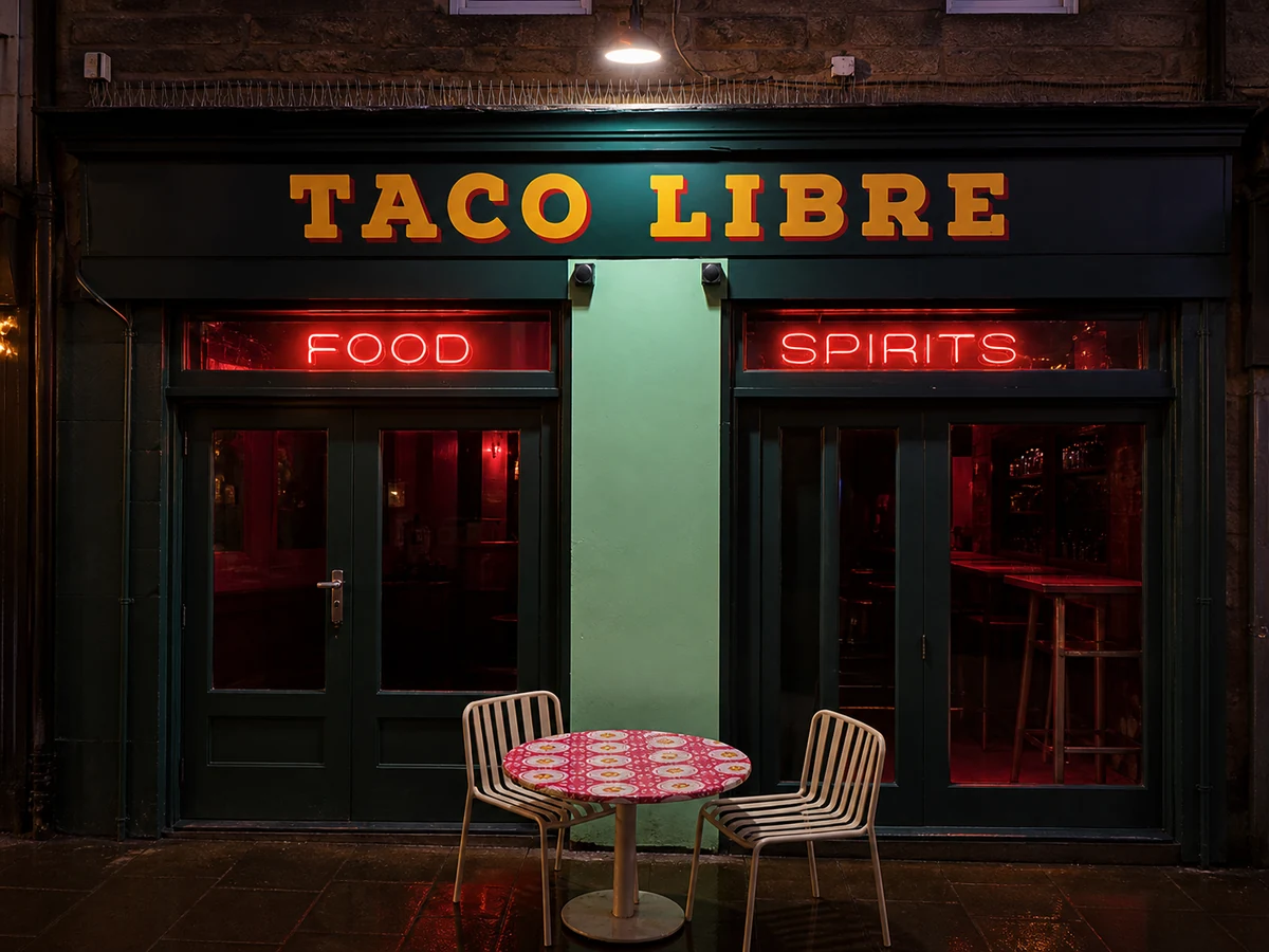 Taco Libre’s source-led Rose Street frontage, with its dark teal facade, mint-green pilaster, crisp yellow-and-red “TACO LIBRE” lettering and red neon “FOOD” and “SPIRITS”.