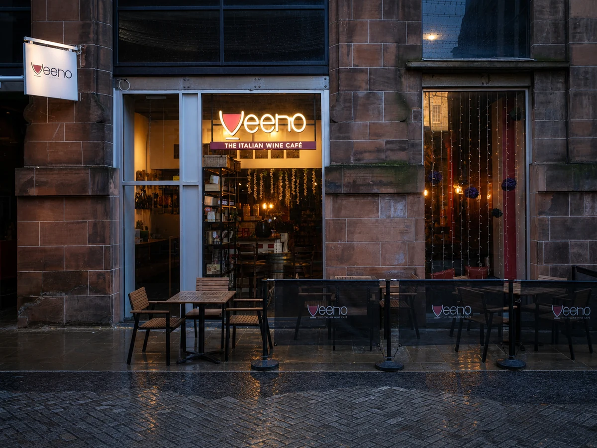 Veeno’s source-led Rose Street frontage: its pink sandstone surround, pale grey glass entrance, warm interior, branded terrace and readable “veeno – THE ITALIAN WINE CAFÉ” sign.