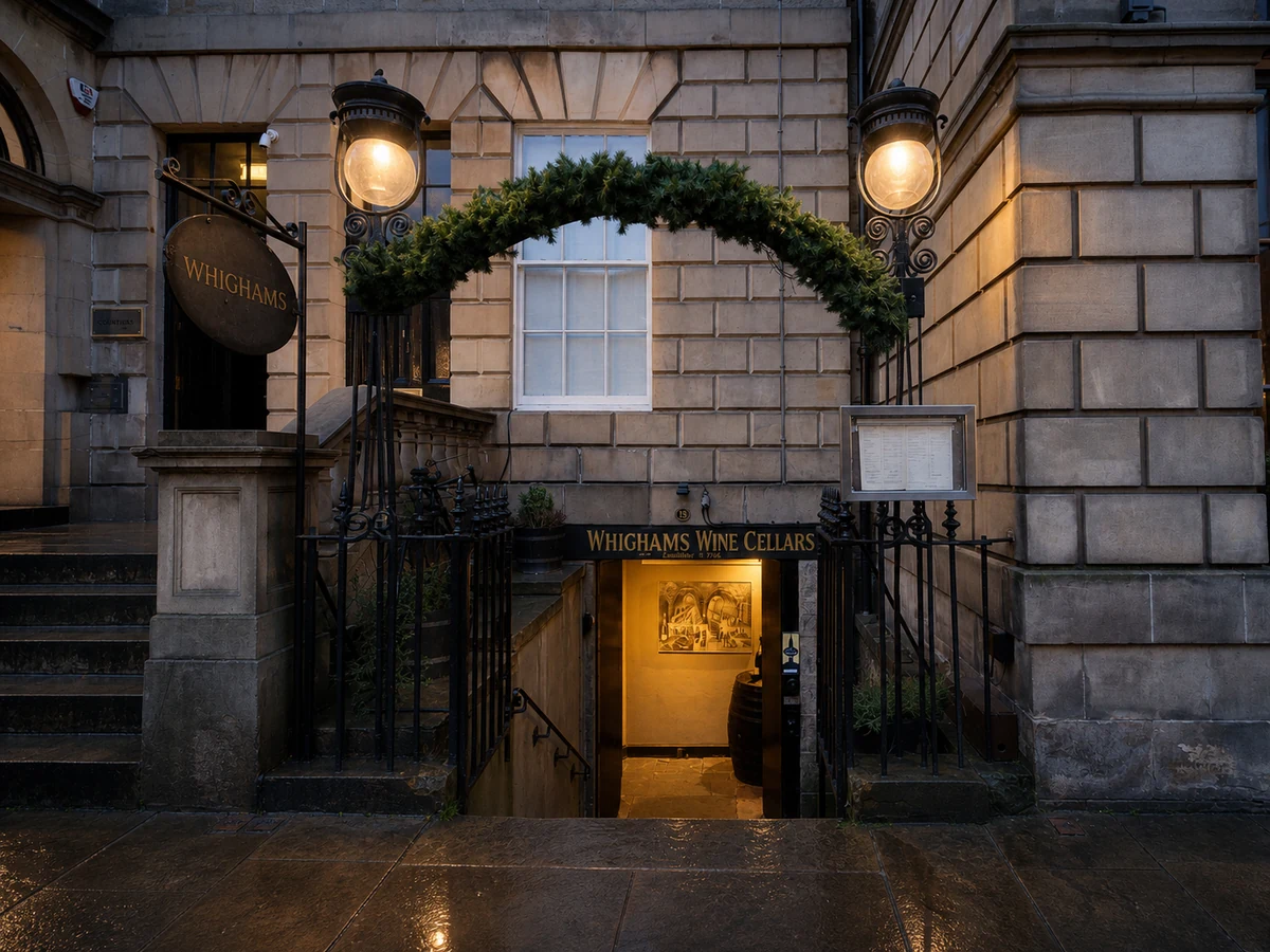 Whighams Wine Cellars’ illuminated basement entrance on Hope Street, Edinburgh.
